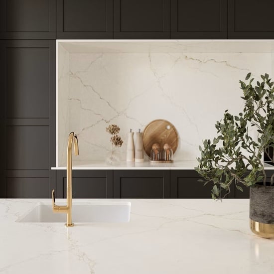 a Silestone Blanc Elysee worktop and splashback in a dark grey kitchen