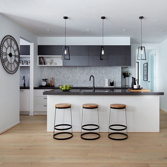 a kitchen with a Caesarstone Raven island and worktops