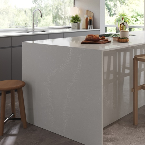 a Caesarstone Alpine Mist island waterfall panel
