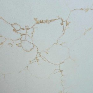 Close-up detail of Calacatta Amber quartz surface in white with fine branching amber gold veins and intricate Calacatta pattern