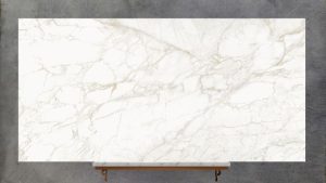 Full slab of Ascale Vagli Gold porcelain with gold veining on white background for worktops by Worktop Library