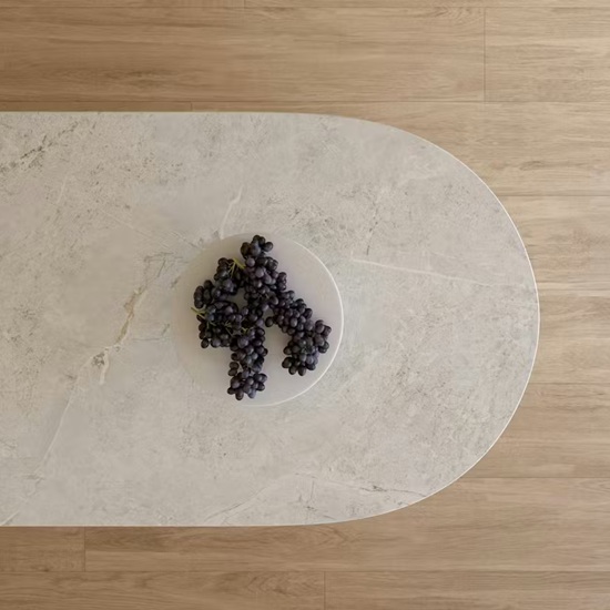 Dekton Evok oval countertop with plate of grapes on wooden floor