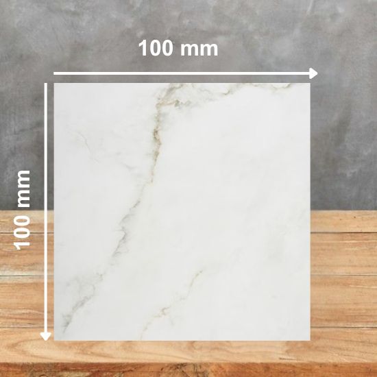 Dekton Keena 100mm x 100mm sample tile showing white base with golden veins