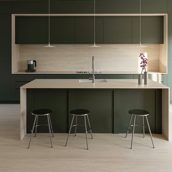 Dekton Zira countertop and flooring in a dark green modern kitchen with island and stools