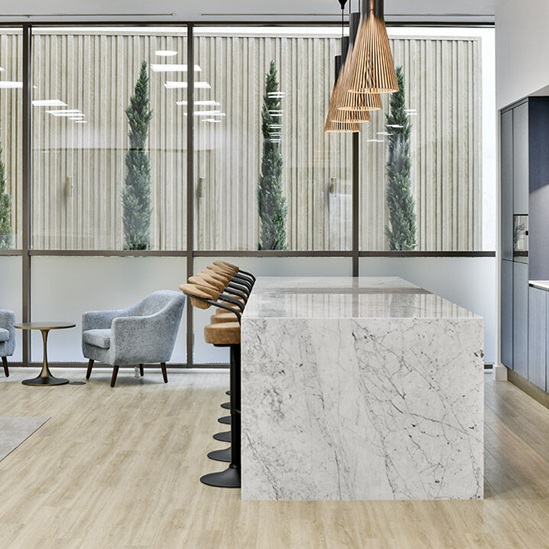 White marble kitchen island and worktop installed in Savile Row office by Worktop Library.