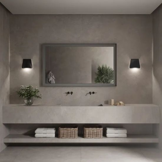 Neolith Artisan bathroom vanity worktop in soft grey with subtle texture, double sink, black taps, mirror, and wall sconces