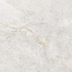 Close-up of Neolith Everest Sunrise sintered stone surface showing delicate white base with subtle grey and golden veining