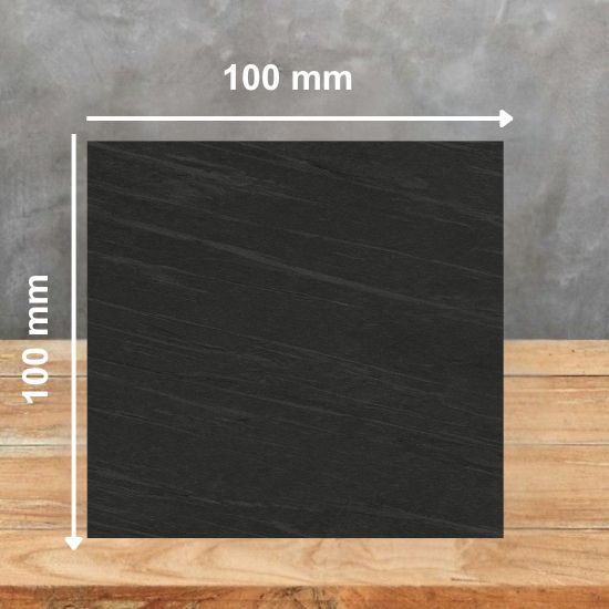 100mm x 100mm sample tile of Neolith Ignea sintered stone highlighting deep grey tone and subtle veining