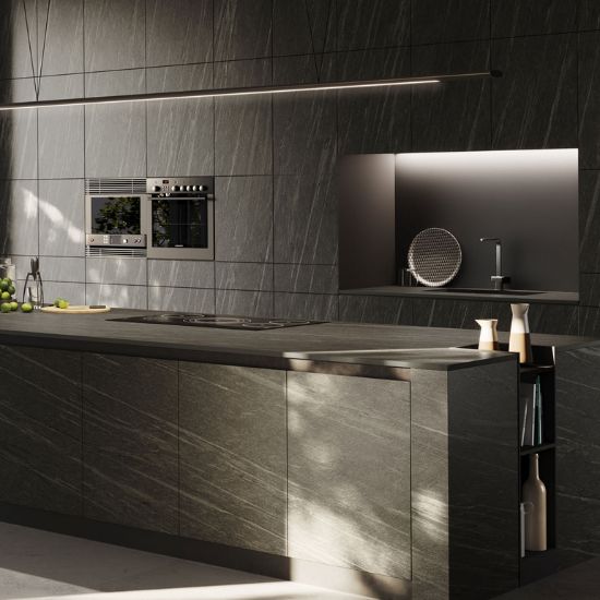 Neolith Ignea kitchen island worktop and splashback in deep grey slate effect, with appliances, linear light, and fruit decor