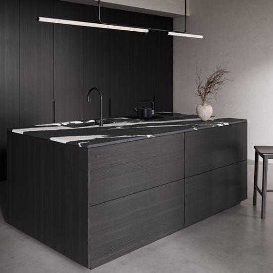 Neolith Victoria kitchen island worktop in deep black with bold white veins, integrated sink, and black tap in modern dark kitchen