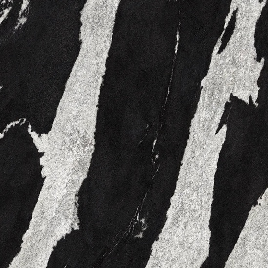 lose-up of Neolith Victoria sintered stone showing deep black with white veining, adorned with branches, marble hexagon, and wooden accents