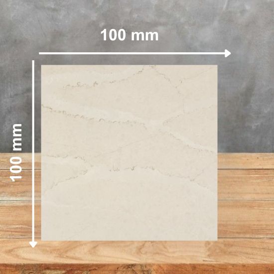 100mm x 100mm sample tile of Silestone Calacatta Tova quartz worktop on wooden surface with measurements