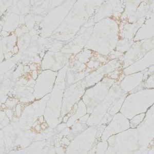 Arabescato Oro quartz kitchen worktop in white with gold and grey veins, featuring a modern sink, arched window, and decorative plants in a bright contemporary kitchen setting from the Essex Quartz Collection