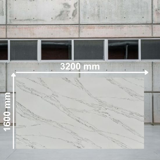Full slab of Calacatta Ophelia quartz measuring 3200 mm by 1600 mm, white with grey veins, displayed in a concrete warehouse setting