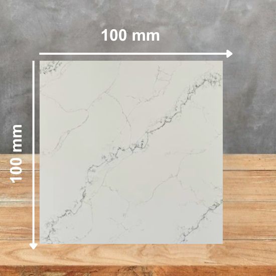 100 mm square sample of Calacatta Verde quartz in white with grey veining, displayed on a wooden surface against a grey background