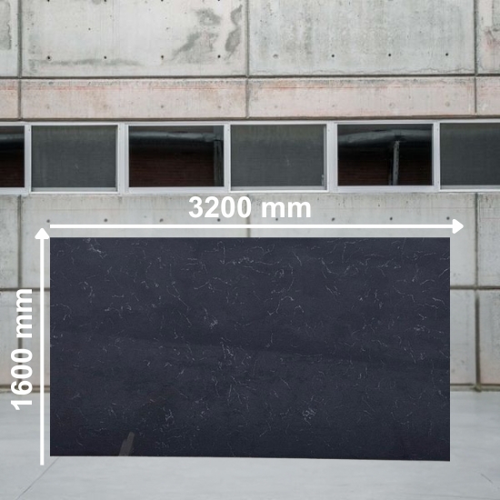 Large slab of Carrara Nero quartz in white with subtle black veins, positioned against a concrete warehouse wall