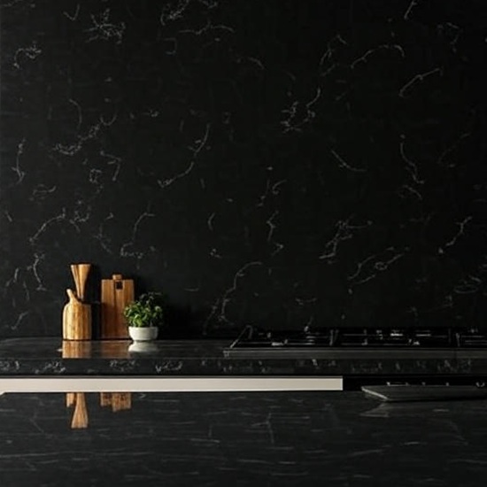 Calacatta Black quartz kitchen worktop in white with bold black veins, featuring wooden cabinets, pendant lights, sink, oven, and fruit bowl in a modern kitchen from the Essex Quartz Collection