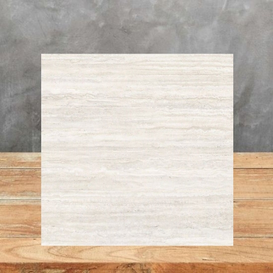 Techlam Travertino Pearl sample tile on wooden display surface showing light travertine pattern