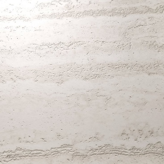 Close-up of Techlam Travertino Pearl sintered stone showing natural porous travertine texture and layered surface