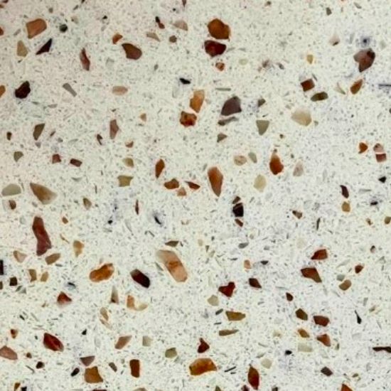 close-up of Venezia quartz texture, cream base with scattered brown, beige, and white specks in a terrazzo-inspired pattern