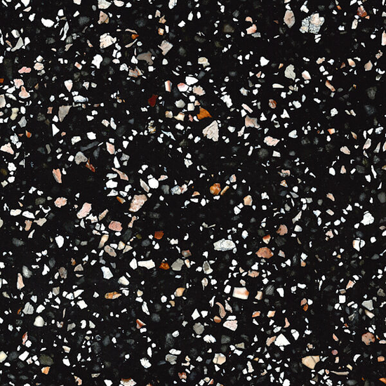 High-resolution close-up texture of Quartzforms Terrazzo Doge quartz, deep black base densely speckled with white pink and copper chips in terrazzo pattern