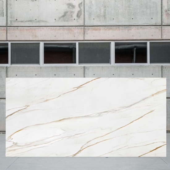 Horizontal full slab of Techlam Macchia Gold against concrete background