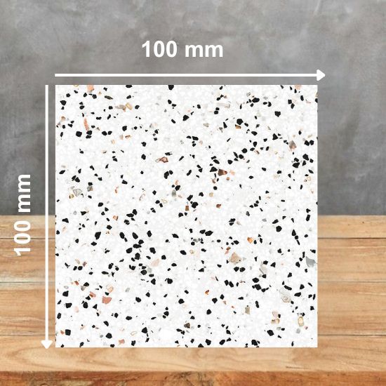 SuggestionAlt Text100 mm square sample of Quartzforms Terrazzo Fenice quartz in bright white base with dense black grey pink and copper specks, displayed on wooden surface