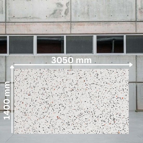 Large slab of Quartzforms Terrazzo Fenice quartz measuring 3050 mm by 1400 mm, bright white base with dense black grey pink and copper specks, displayed in warehouse setting