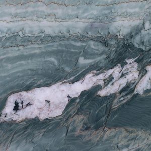 Swirling macro pattern of Green Maestro Quartzite with green, white and grey veins