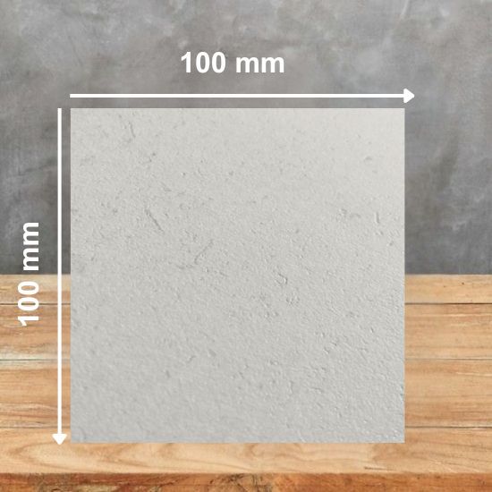 100 mm square sample of Techlam Limestone by Levantina, soft light grey with subtle natural limestone texture, displayed on wooden surface