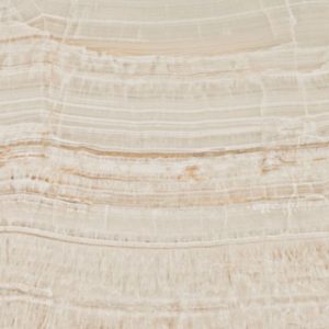 Close-up texture of Caesarstone Onyxa quartz worktop showing delicate horizontal veining in soft beige, cream and warm taupe on an ivory background.