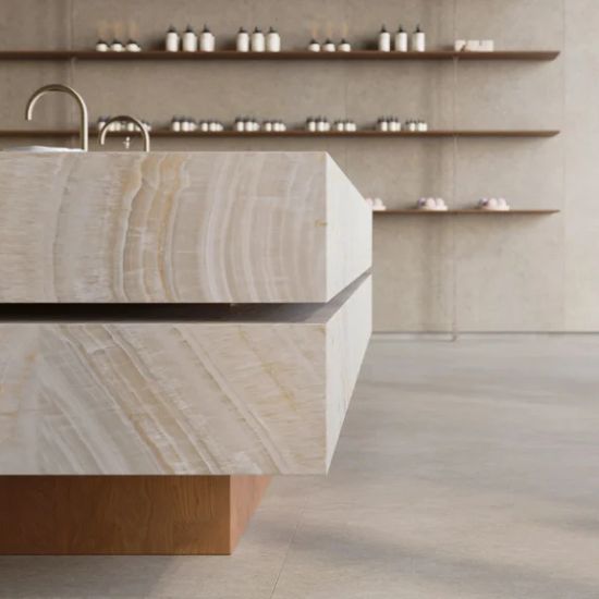 Close-up of substantial mitered edge on Caesarstone Onyxa kitchen island worktop showing continuous veining and dramatic thickness.